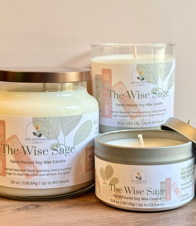Three 'The Wise Sage' rosemary and sage candles of different sizes on a wooden surface with a neutral background.