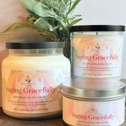 Three lavender and sage labeled 'Saging Gracefully' on a wooden surface with a plant in the background.