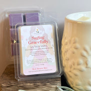 Lavender and Sage scented soy wax melts packaging with a wax melter on a wooden surface