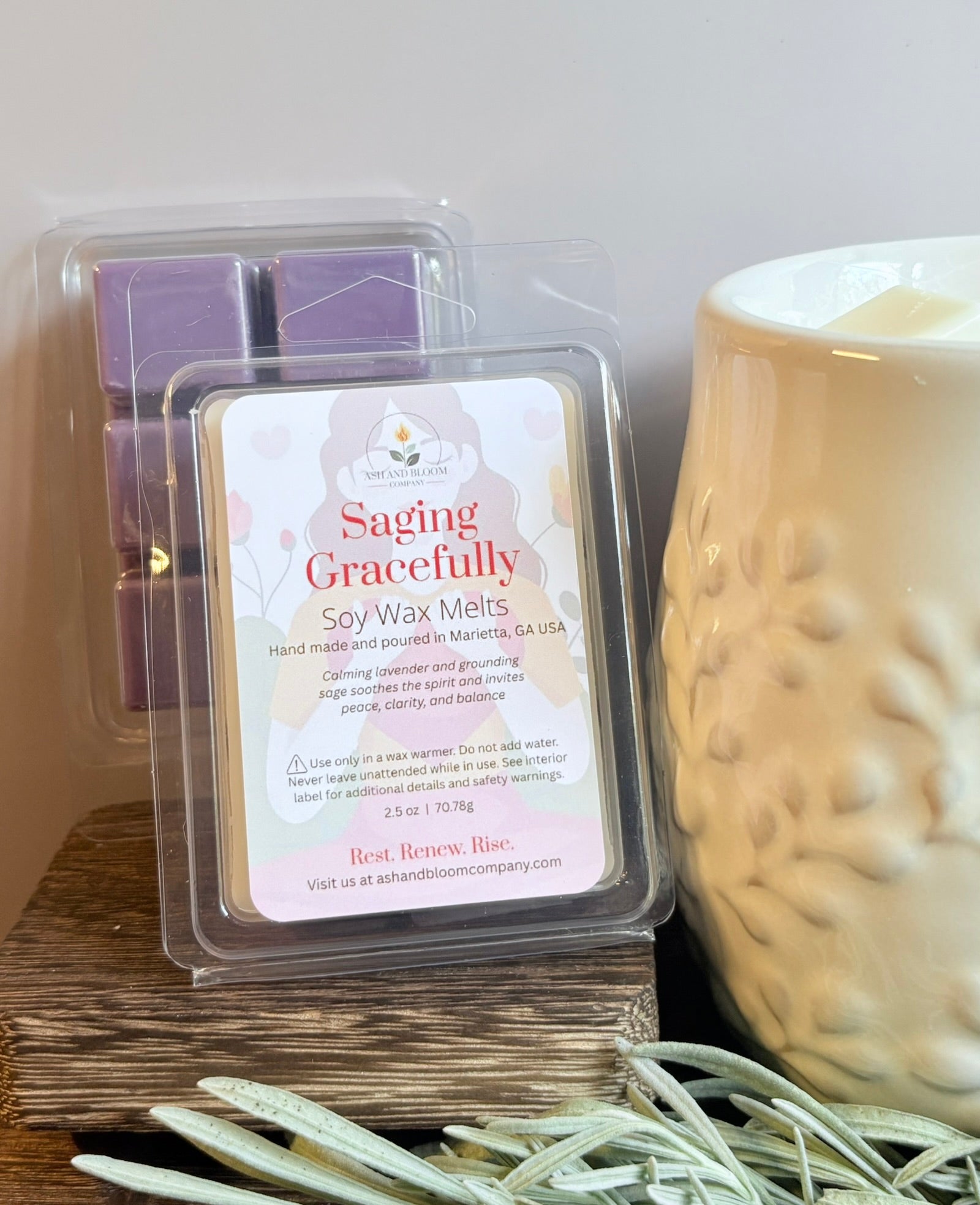 Lavender and Sage scented soy wax melts packaging with a wax melter on a wooden surface