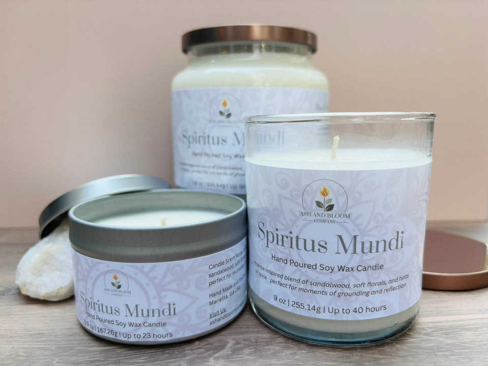 Three 'Spiritus Mundi' nag champa candles of different sizes on a neutral background