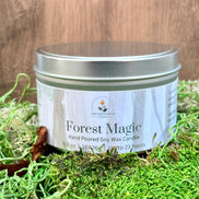 Candle jar labeled 'Forest Magic' on a grassy background