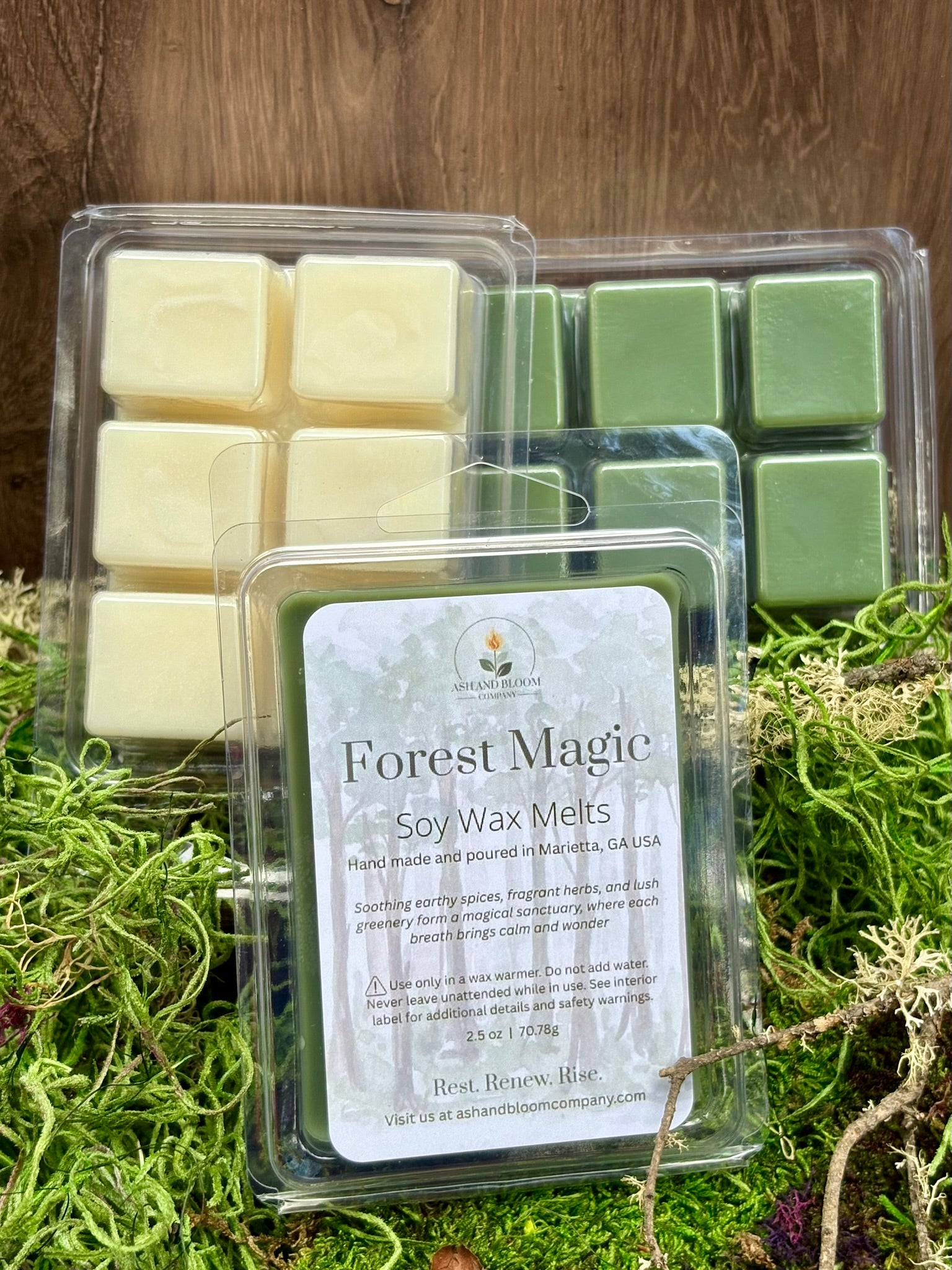 Packaged Forest Magic woodsy herbals soy wax melts on a natural background