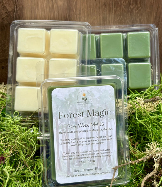 Packaged Forest Magic woodsy herbals soy wax melts on a natural background