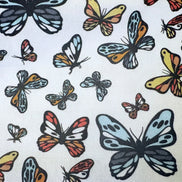 Pattern of colorful butterflies on a white background