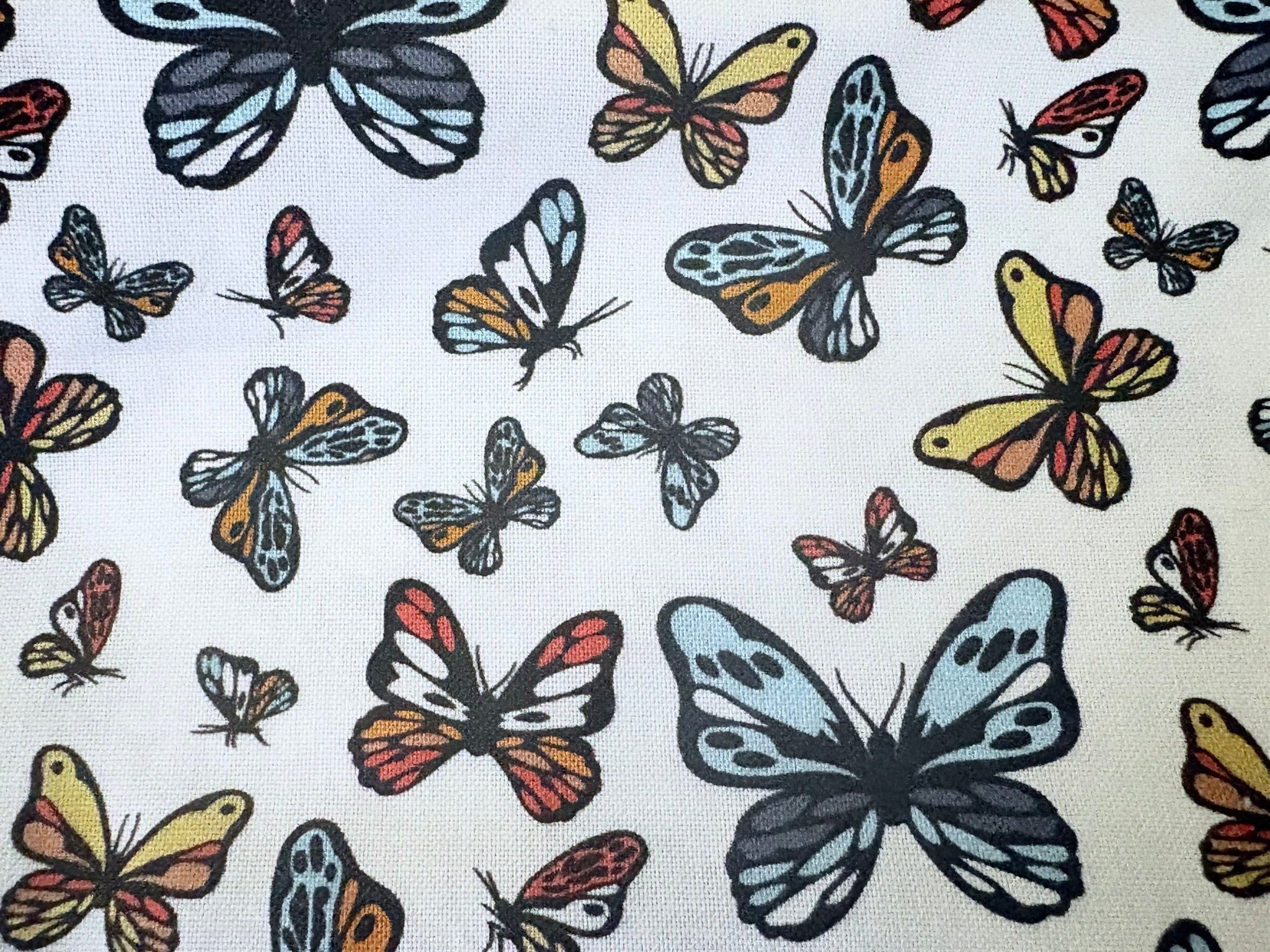 Pattern of colorful butterflies on a white background