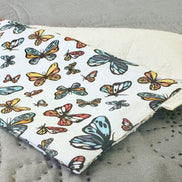 Fabric with butterfly pattern on a gray surface