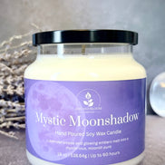 Mystic Moonshadow candle with a purple label on a gray background