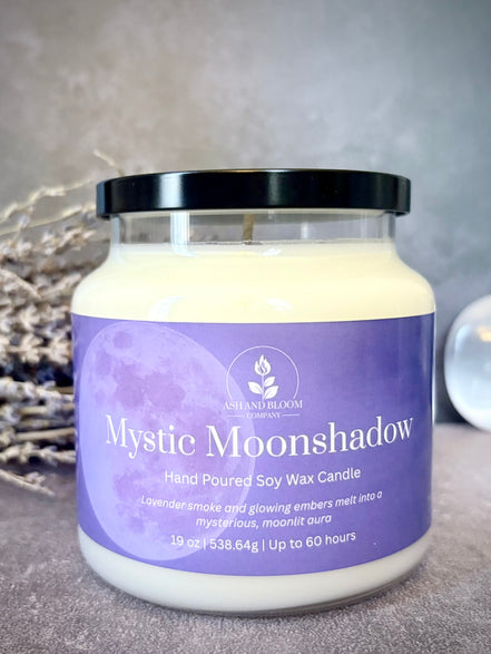 Mystic Moonshadow candle with a purple label on a gray background