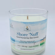 Candle in a glass jar with a label on a white background