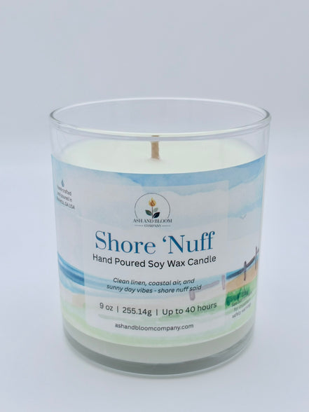 Candle in a glass jar with a label on a white background