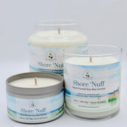 Three 'Shore 'Nuff' candles in different packaging on a white background