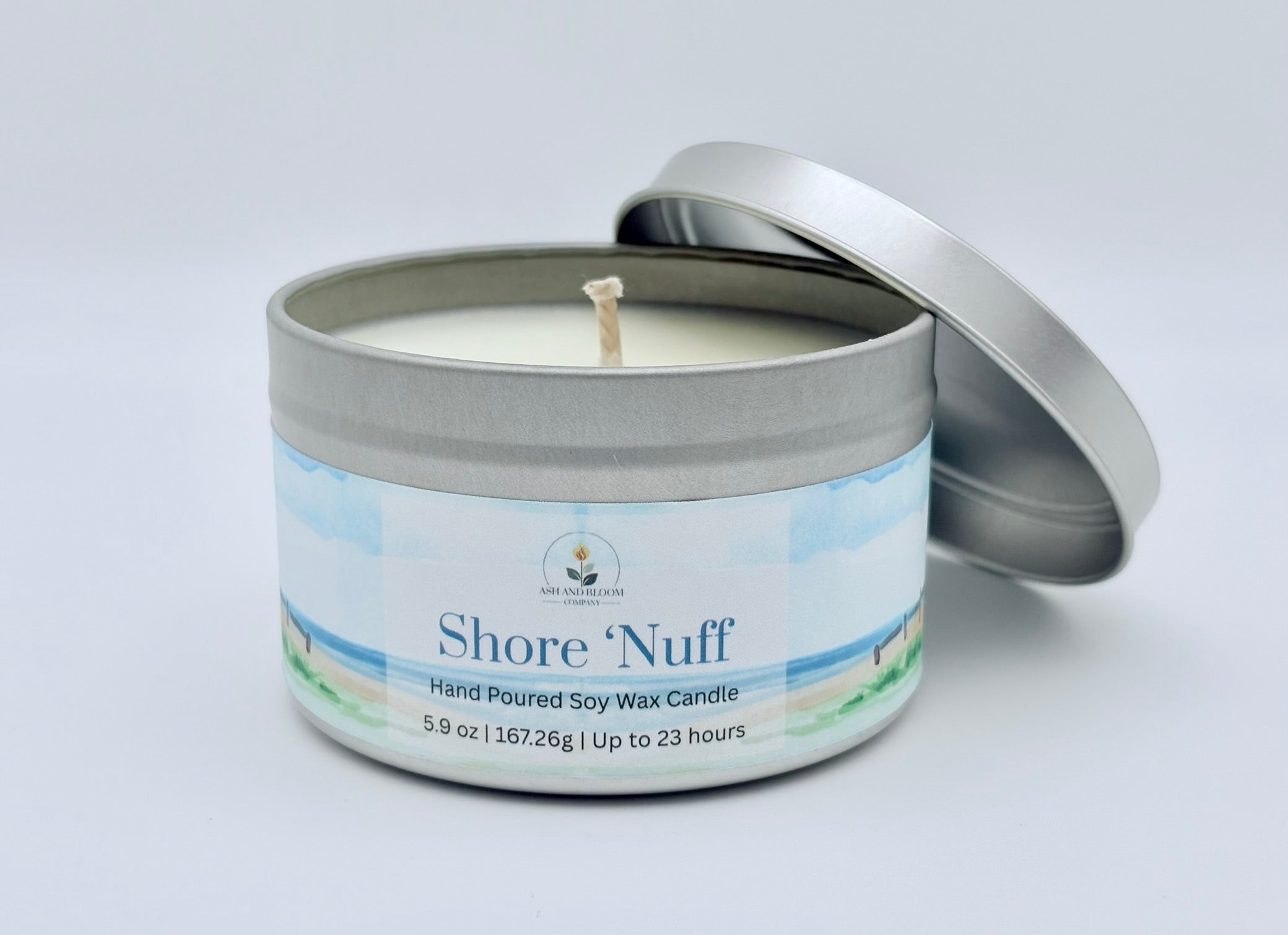 Shore 'Nuff candle in a metal tin with a white background
